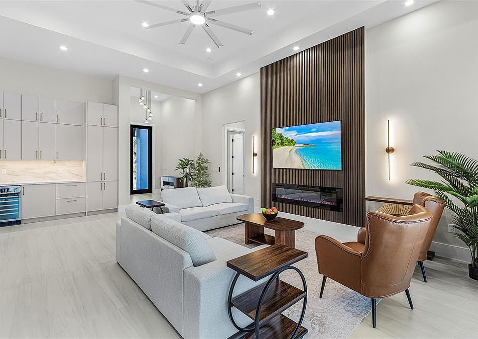 Atenia great room with wood TV wall and premium smooth wall finish