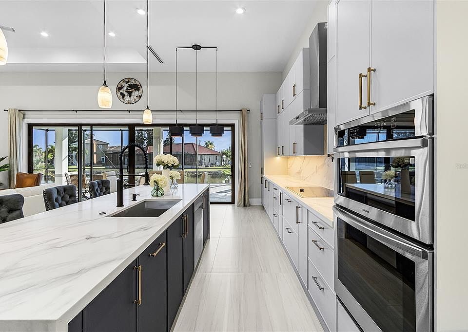 Atenia kitchen looking toward the lanai and canal-facing glass doors