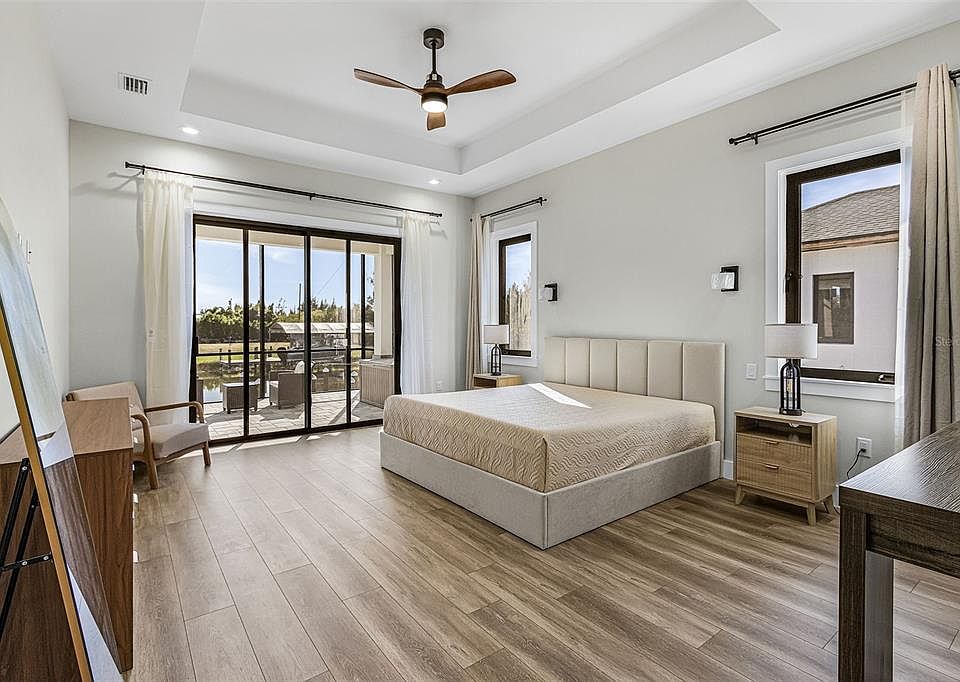 Atenia bedroom opening toward the lanai and canal