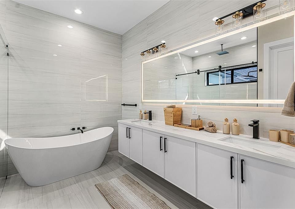 Atenia spa bathroom with soaking tub, large shower and double vanity